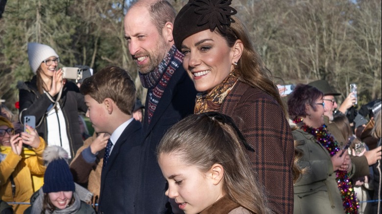 Prince George, Prince William, Kate Middleton, and Princess Charlotte walking