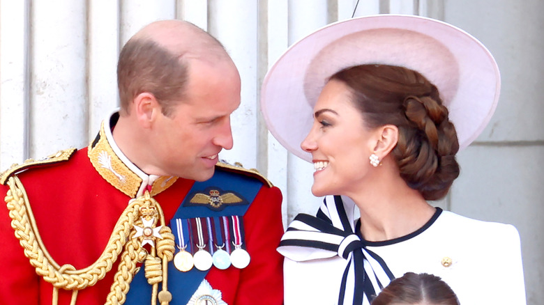 Prince William and Princess Catherine smiling at each other
