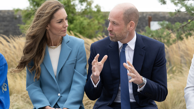 Princess Catherine looking at Prince William as he speaks