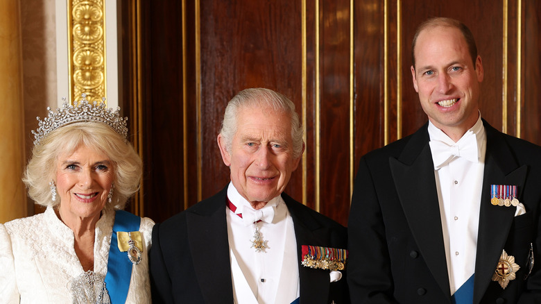 Queen Camilla poses with King Charles III and Prince William