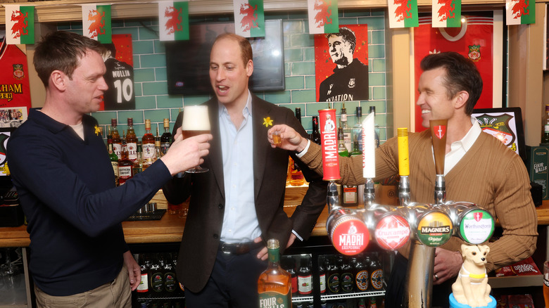 Wayne Jones, Prince William and Rob McElhenney toasting