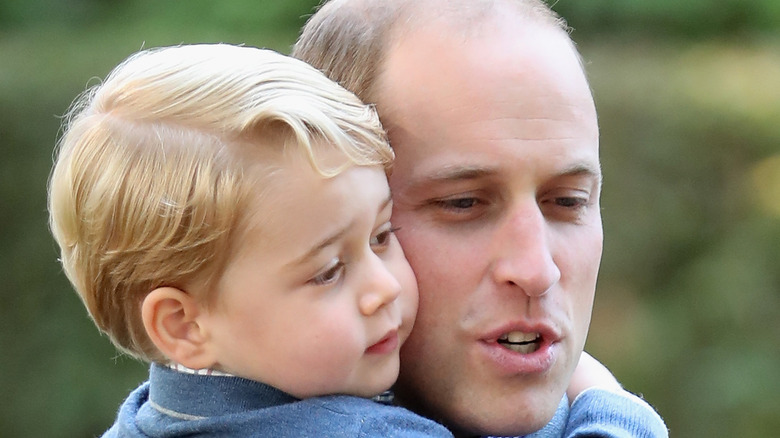 Prince William and Prince George embracing