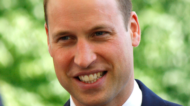 Prince William smiling at a royal event 