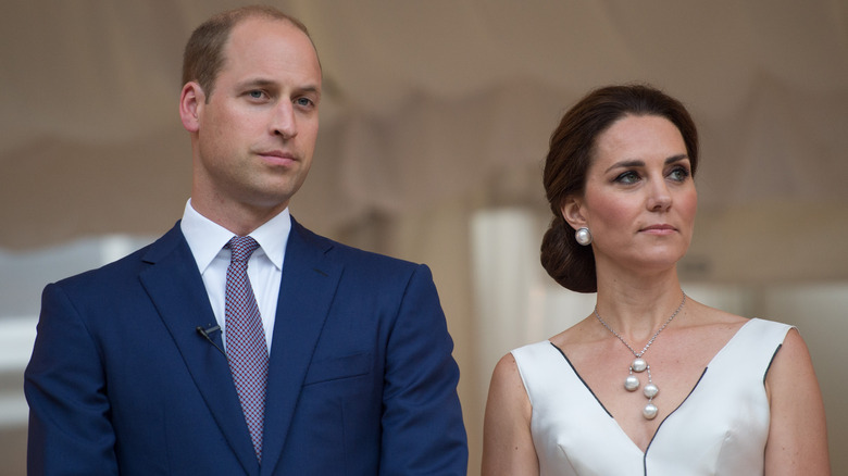 Prince William and Kate Middleton looking stern