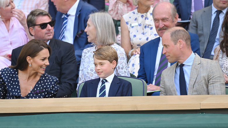 Kate Middleton, Prince George and Prince William seated at Wimbledon