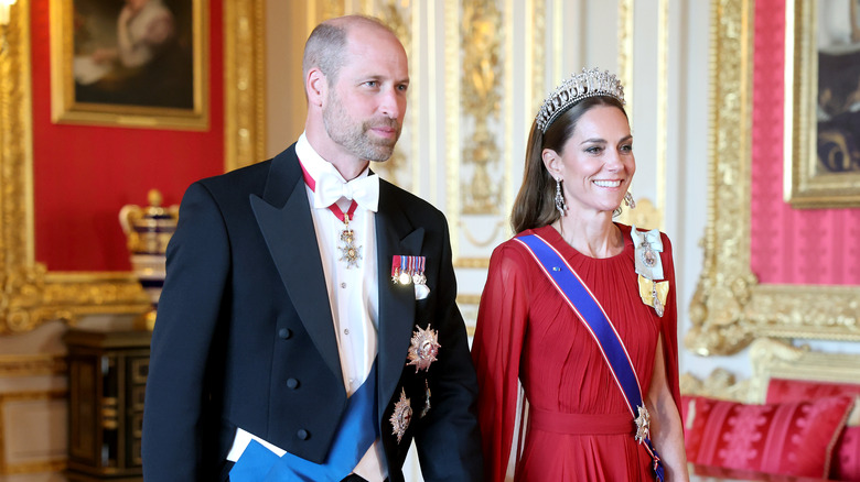 Prince William and Princess Catherine walking in full regalia