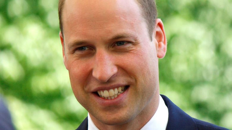 Prince William smiles for the camera