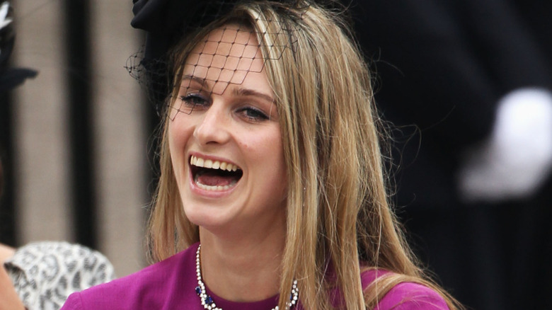 A laughing Bryony Daniels leaving the church after she attended Prince William and Princess Catherine's wedding