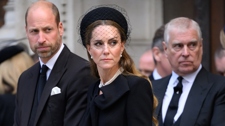 Prince William, Kate Middleton, and Andrew Mountbatten Windsor wearing black