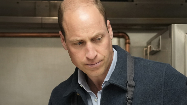 Prince William looking down