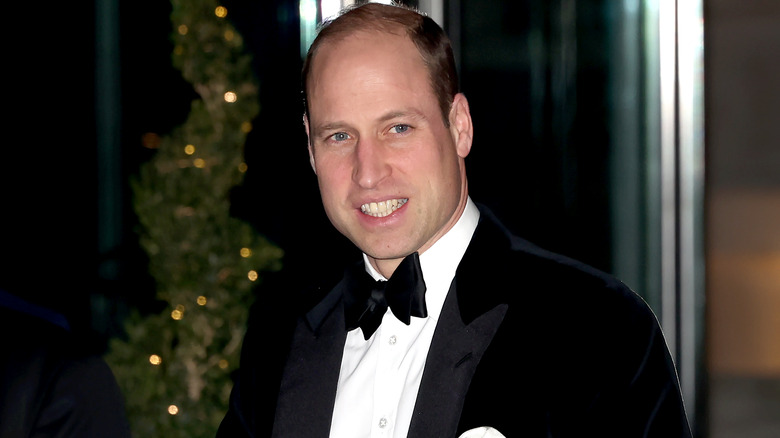 Prince William in black tux and a smile