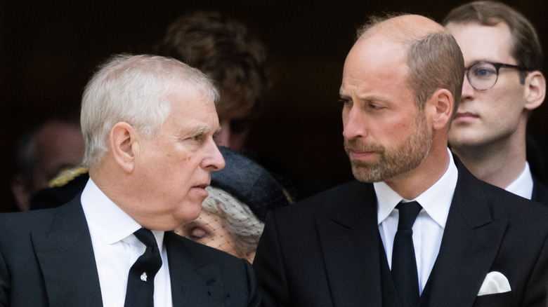 Prince Andrew speaking to William, Prince of Wales at the funeral for the Duchess of Kent