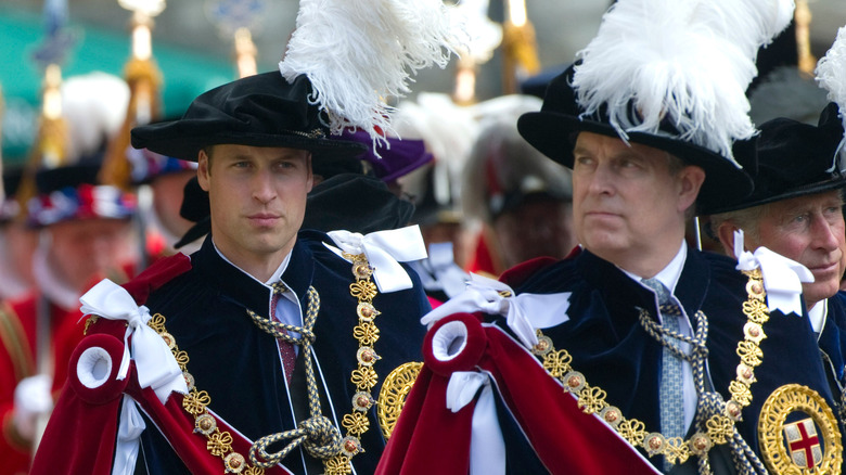 Prince William walking behind Prince Andrew.