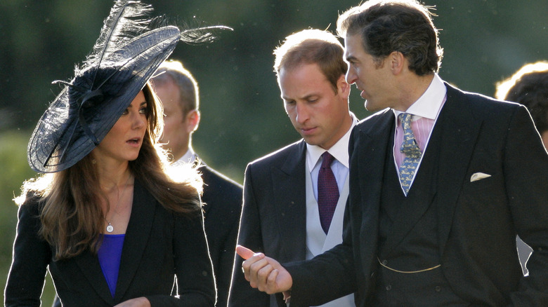 Prince William, Princess Catherine, and Edward van Cutsem chatting at a wedding