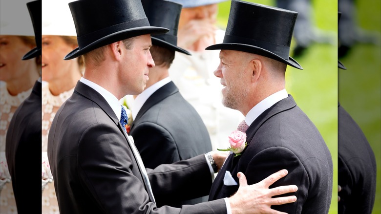 Prince William and Mike Tindall embrace