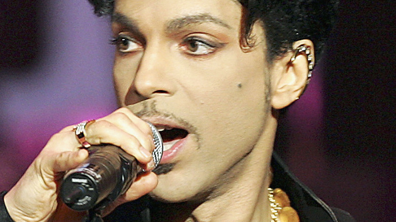 Musician Prince singing on stage
