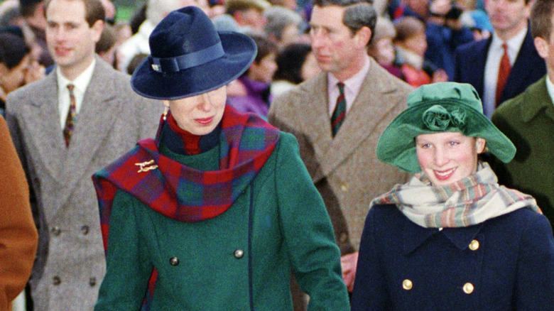 Princess Anne glances at Zara Phillips on the way to St. Mary Magdalene Church