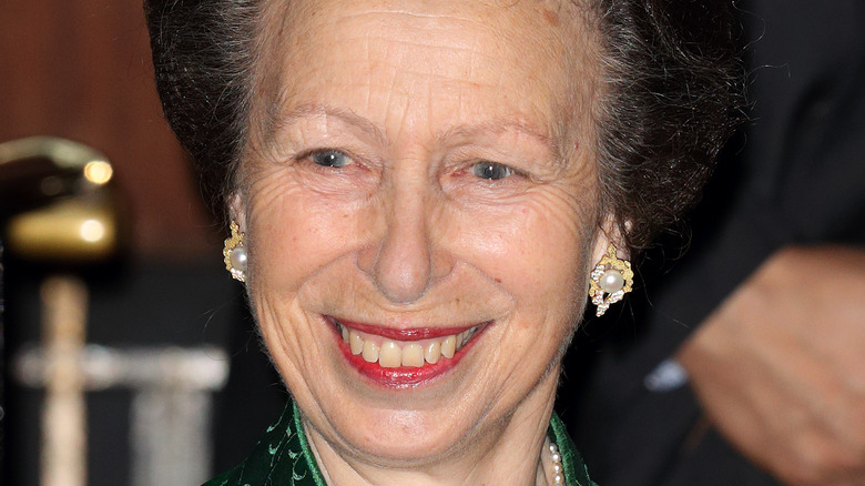 Princess Anne smiling in green