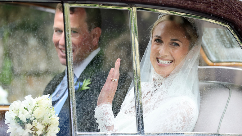 Harriet Phillips smiling with Peter Phillips in the background