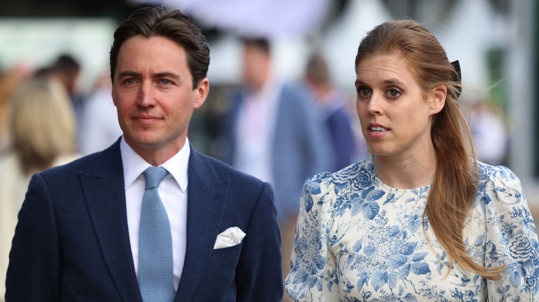 Edo Mapelli Mozzi looking serious and Princess Beatrice talking