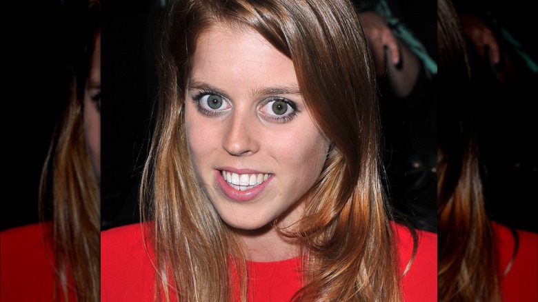 Princess Beatrice smiling at 2012 Paris Fashion Week.