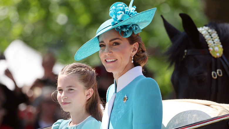 Kate Middleton and Princess Charlotte in a horse drawn carriage at Trooping the Colour
