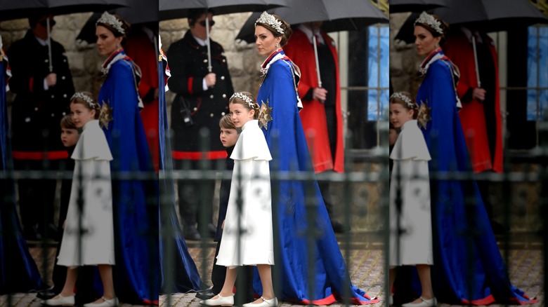 Kate Middleton in a blue robe and Charlotte in a white dress at the 2023 coronation of King Charles III
