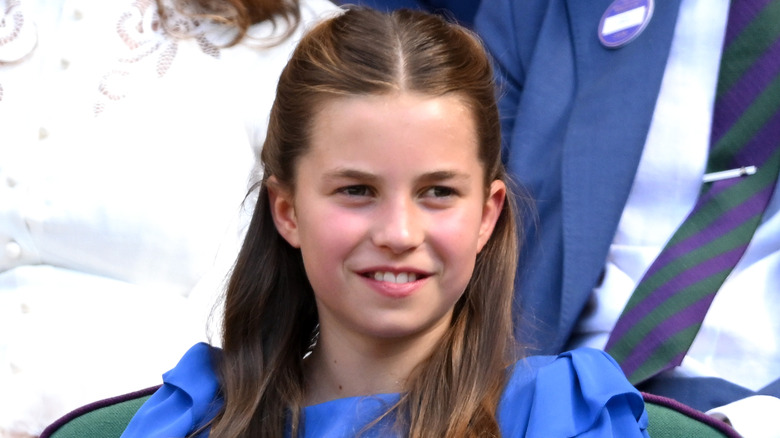 Princess Charlotte smiling in blue dress