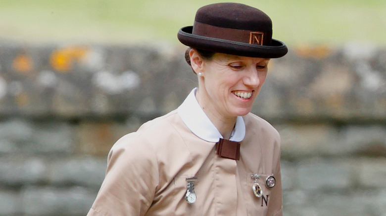A smiling Maria Borrallo wearing her Norland uniform