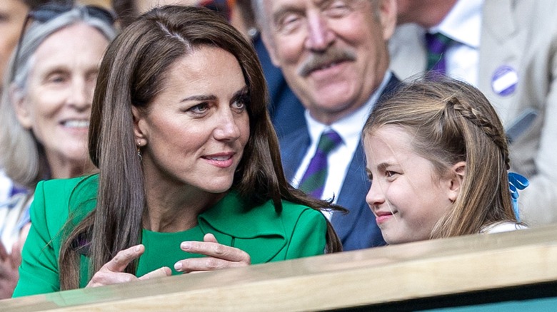 Kate Middleton talking to Princess Charlotte