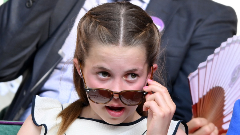 Princess Charlotte pulls down her sunglasses at Wimbledon