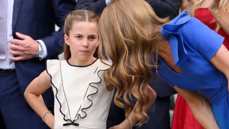 Kate Middleton talks to Princess Charlotte at Wimbledon