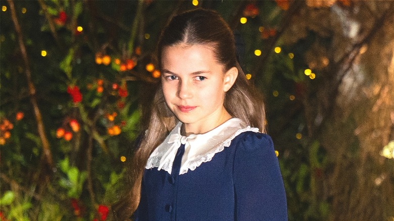 Princess Charlotte wearing a navy dress with white collar at the 2025 Together at Christmas event