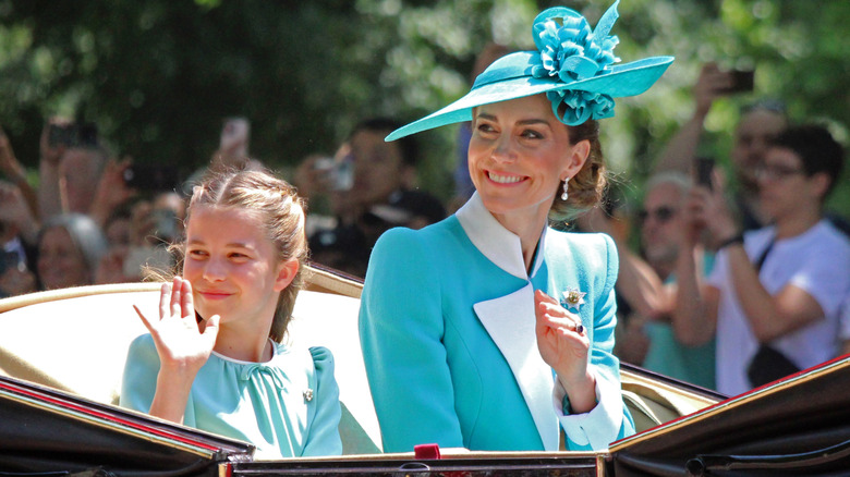 Princess Charlotte and Princess Catherine wearing matching blue outfits at Trooping the Colour 2025
