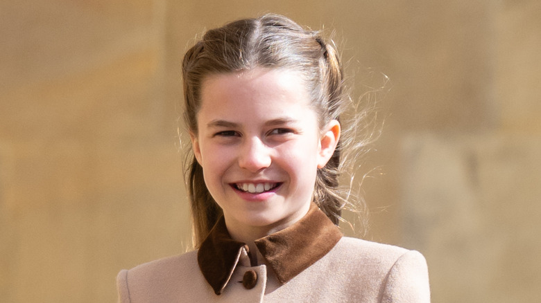 Princess Charlotte smiling outside church
