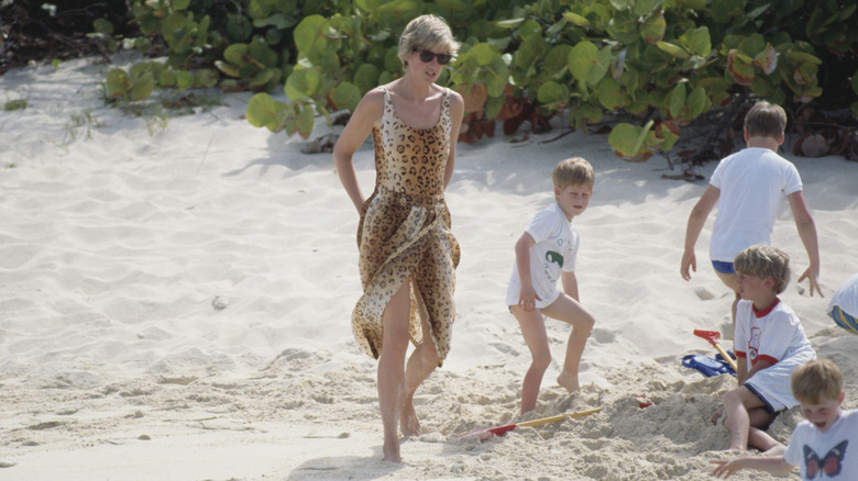 Princess Diana walking on the beach with her kids