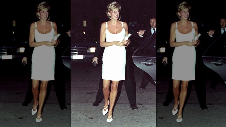 Princess Diana smilng and walking