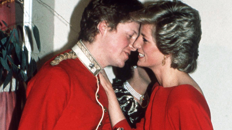 Charles Spencer kissing Princess Diana on the cheek.