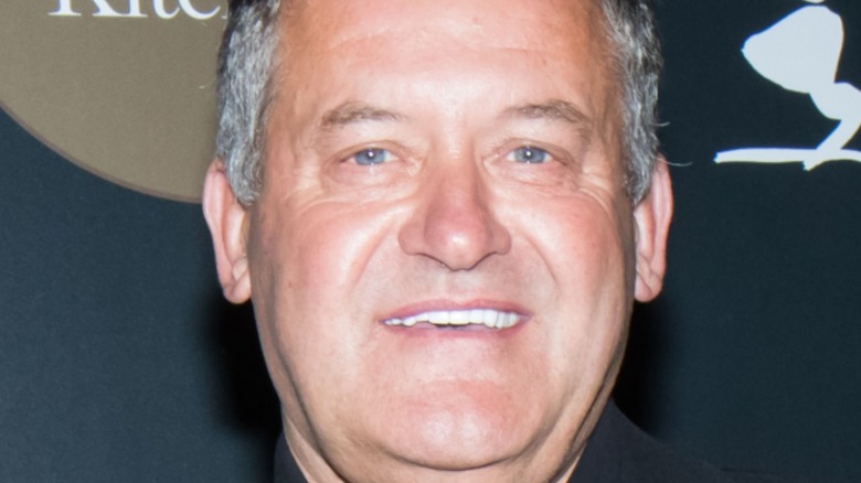 Paul Burrell smiling at event