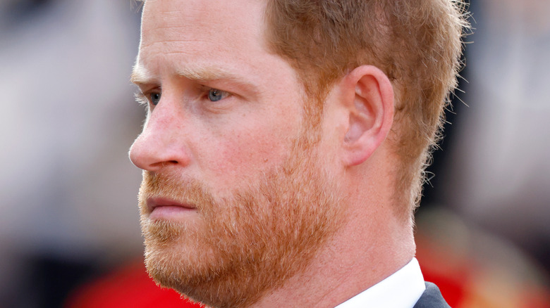 Prince Harry looks pensive at the queen's procession