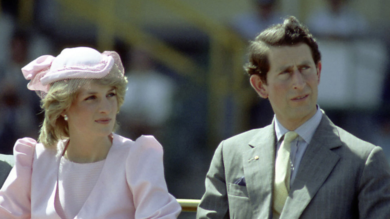 Princess Diana and King Charles III posing 