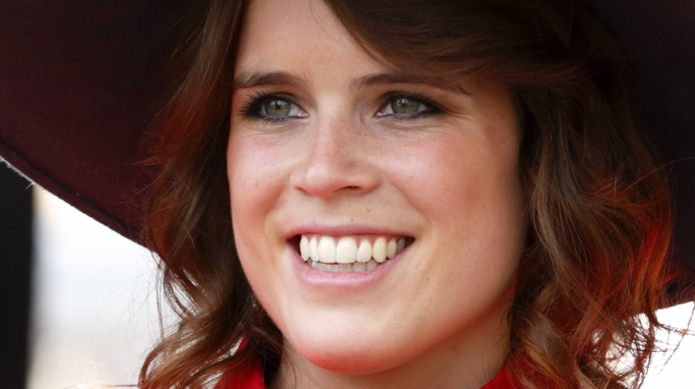 Princess Eugenie smiling in hat