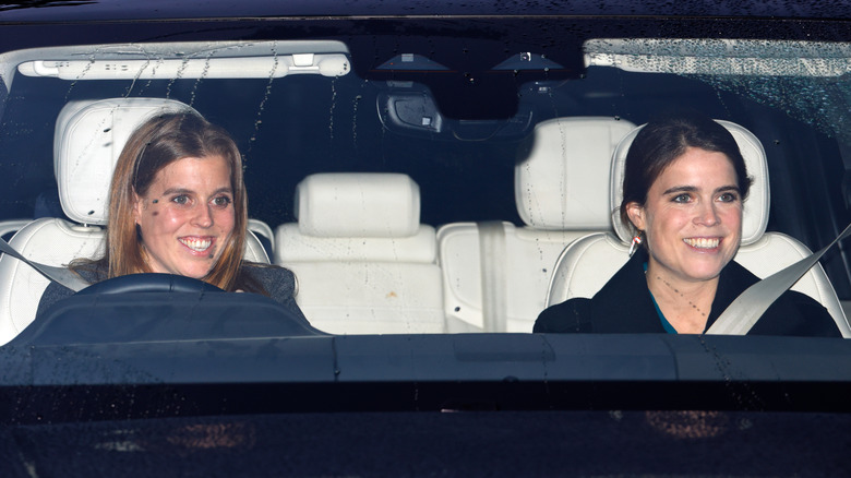 Princess Beatrice and Princess Eugenie in a car