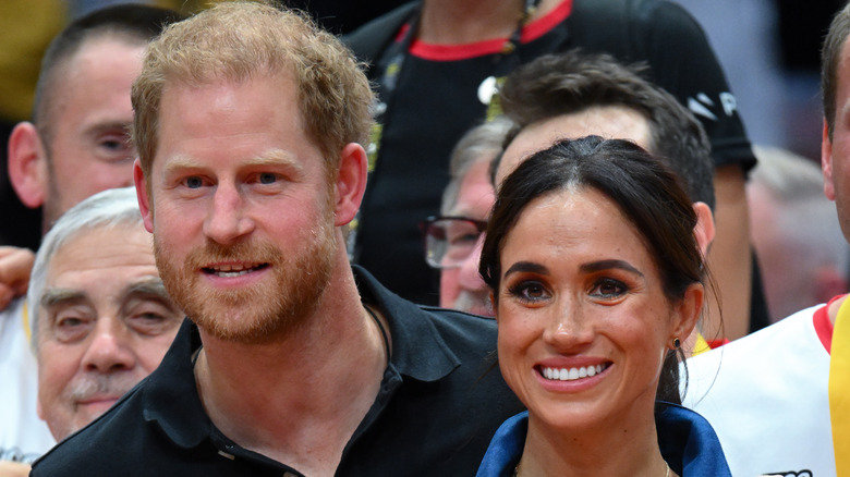 Prince Harry and Meghan Markle sitting at Invictus Games 2024