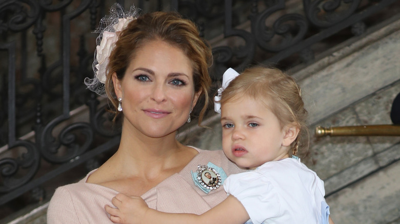 Princess Madeleine and Princess Leonore of Sweden pose for photos after the christening of Prince Oscar of Sweden at Royal Palace of Stockholm in Sweden (2016)