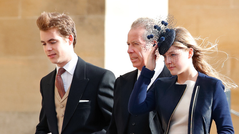 Charles Patrick Armstrong-Jones walks alongside David Armstrong-Jones and Lady Margarita Jones