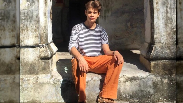 Samuel Chatto sitting outside in India