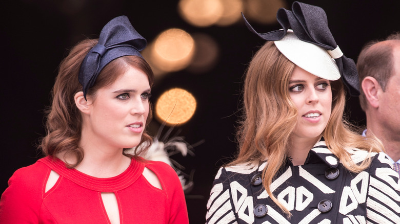 Princess Eugenie and Princess Beatrice looking to the side