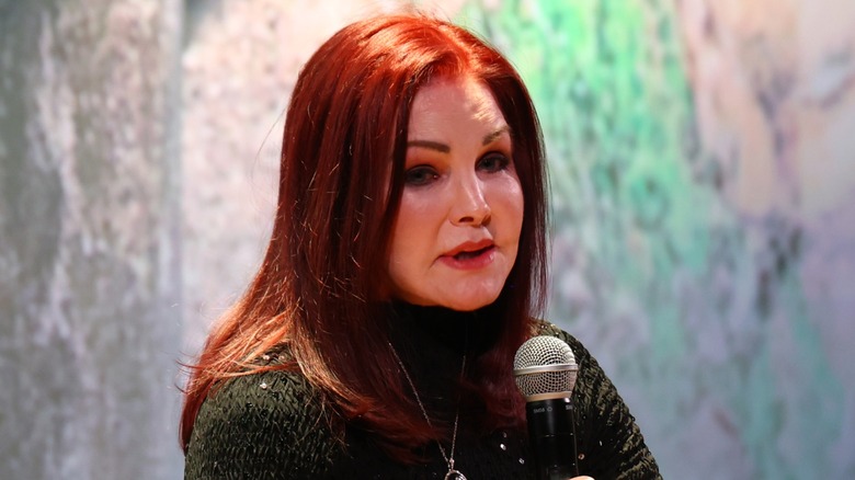 Priscilla Presley speaking onstage in 2025