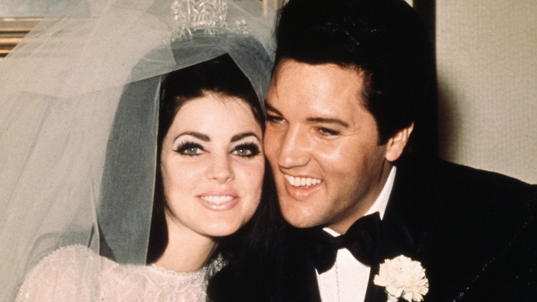 Priscilla and Elvis Presley smiling on their wedding day